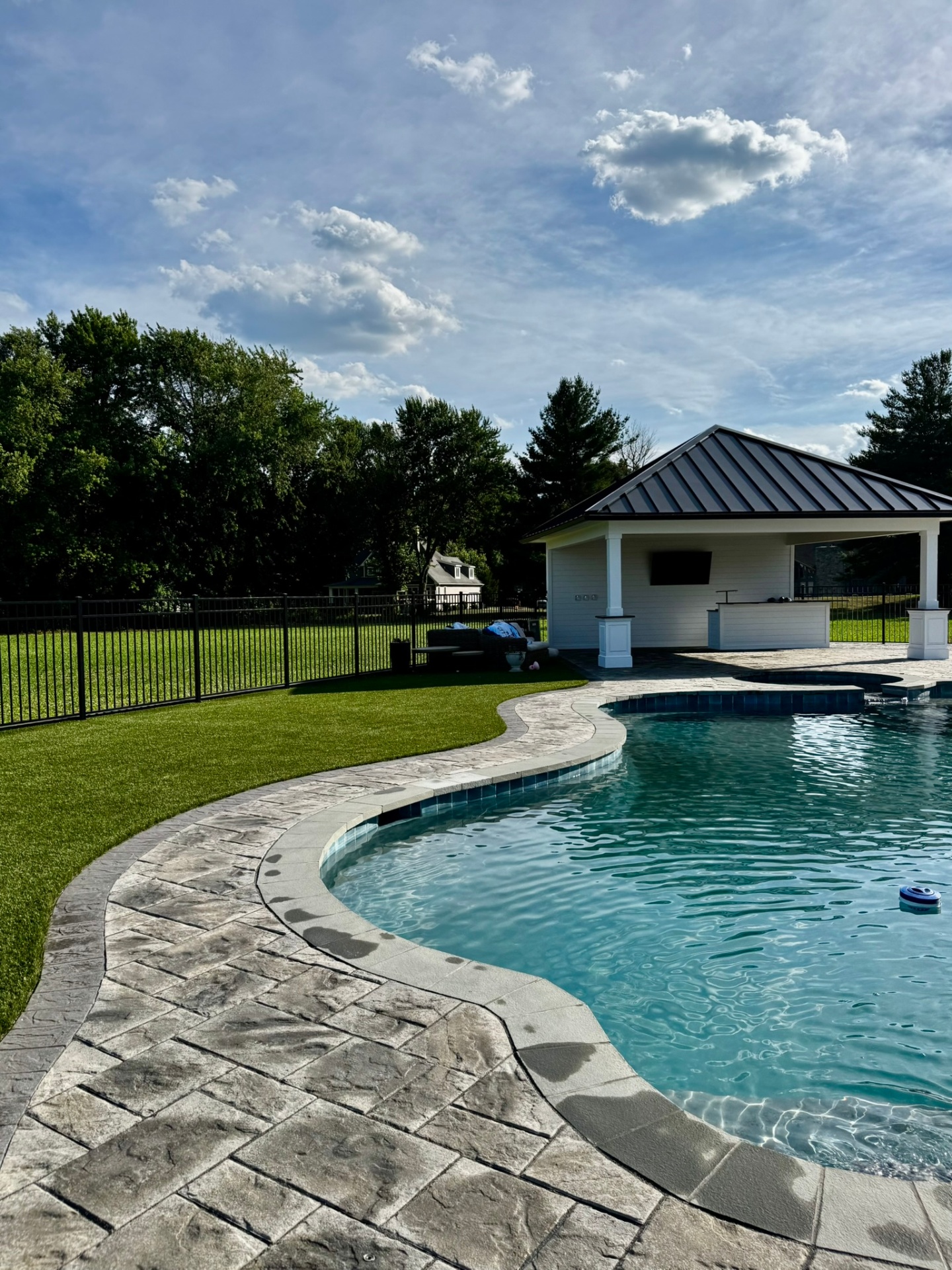 Pool deck & pavilion — East Greenwich, NJ Curved paver pool deck and poolside pavilion in East Greenwich, NJ