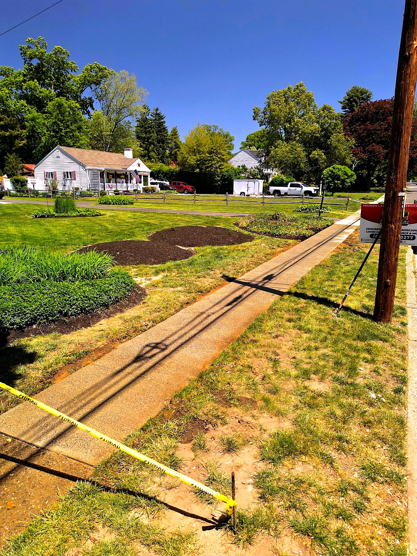 Fresh concrete sidewalk and apron work left side view in New Jersey