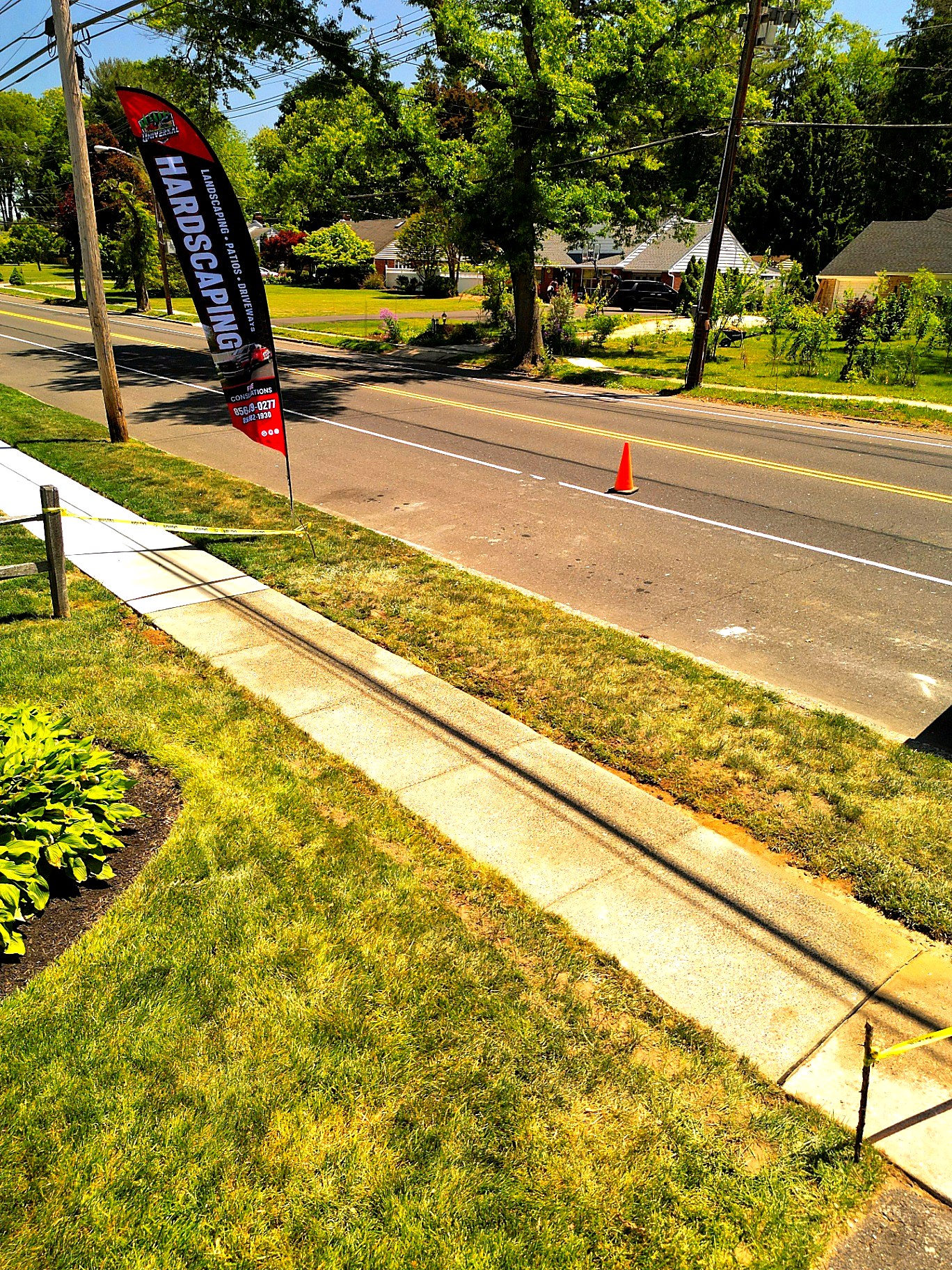 Fresh concrete sidewalk and apron work right side view in New Jersey