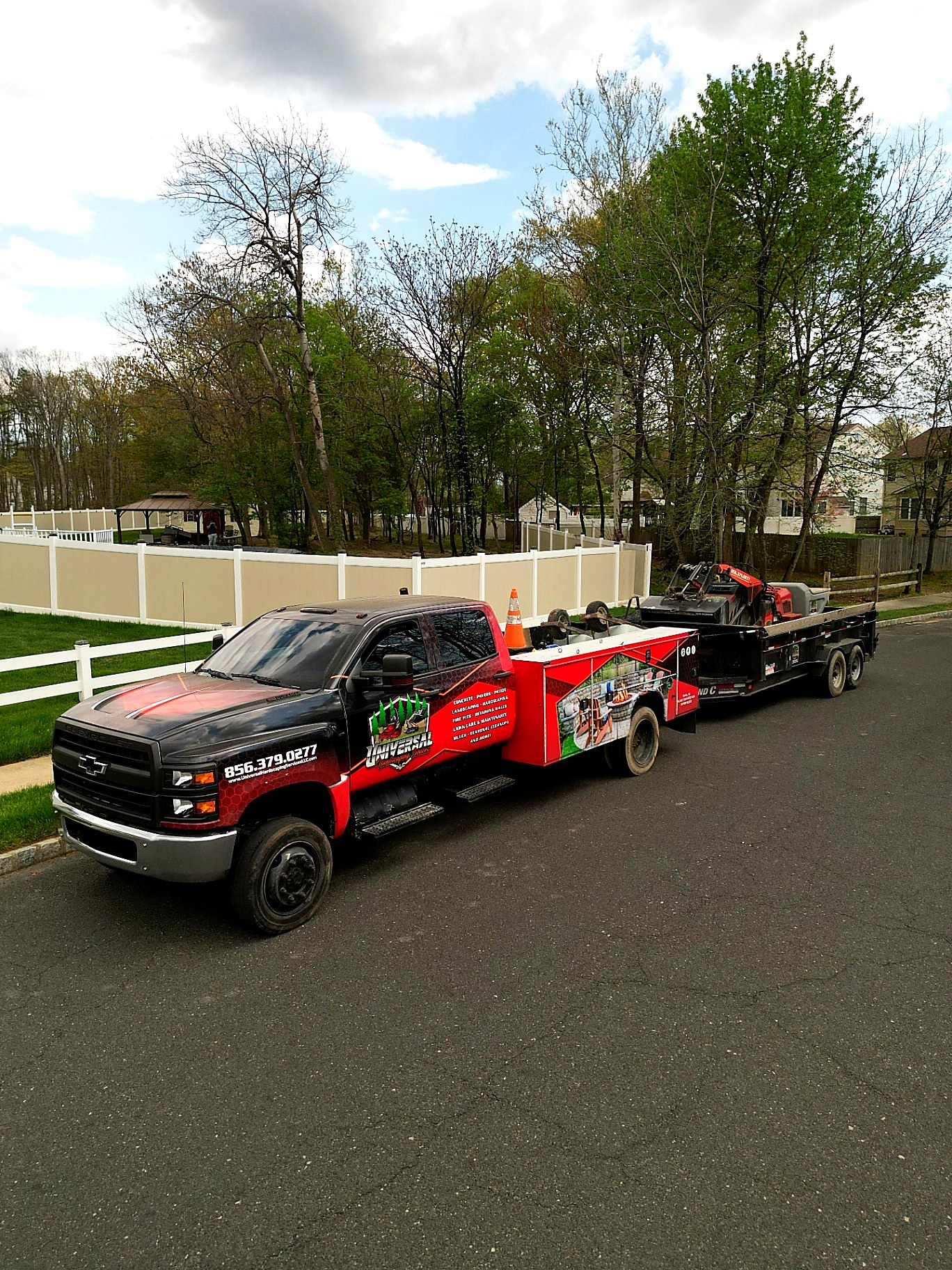 Universal Hardscaping Chevy 6500 company truck on site in New Jersey