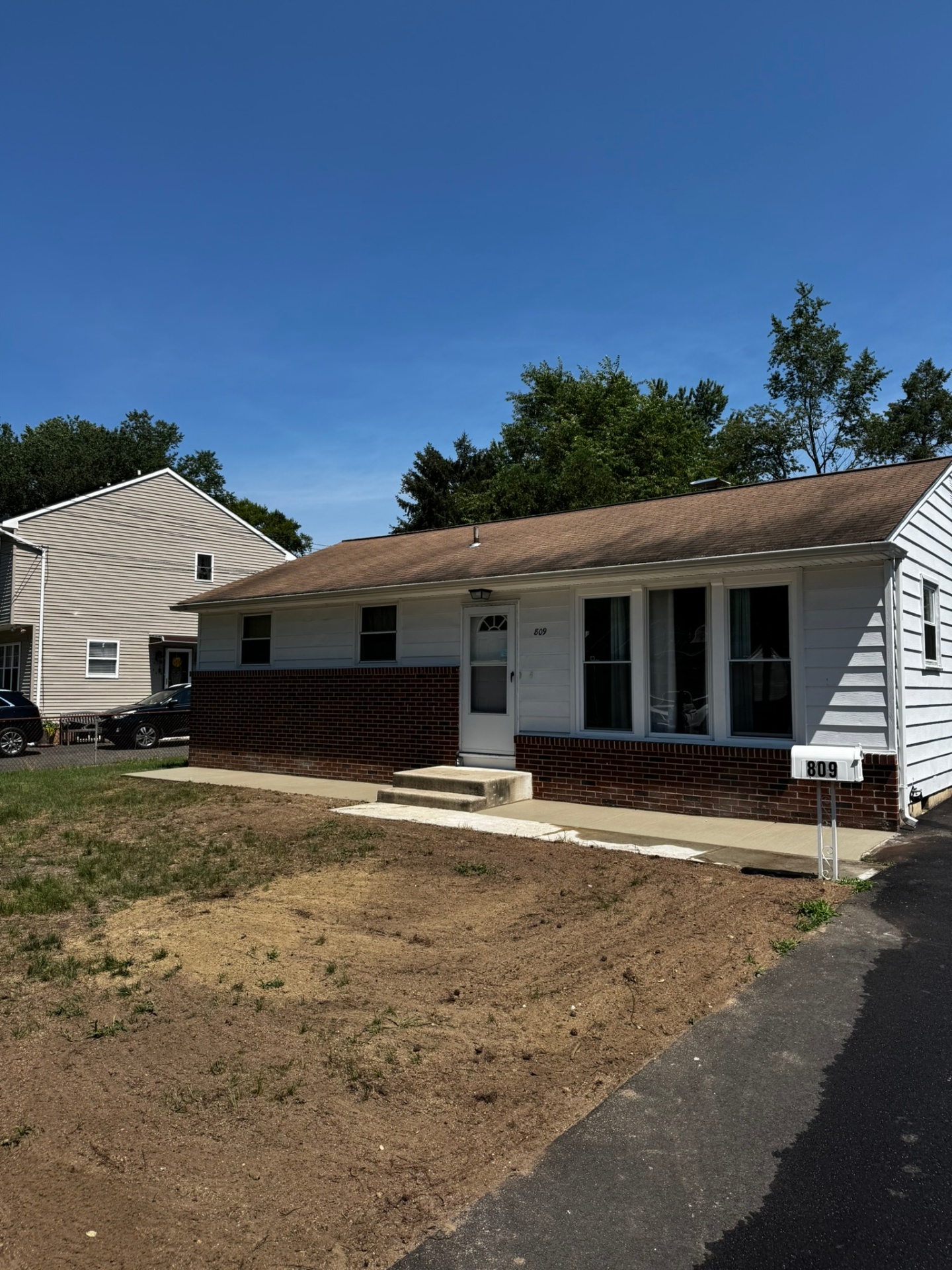 Fresh concrete porch area and front entry apron at a Lindenwold home