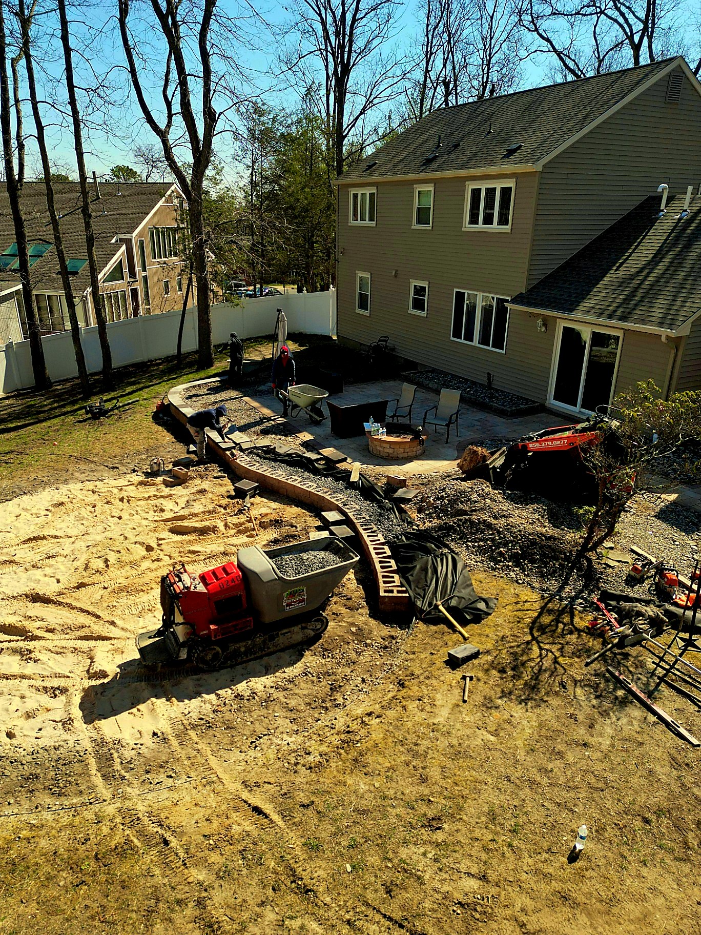 Aerial view of crew installing a retaining wall in Voorhees New Jersey